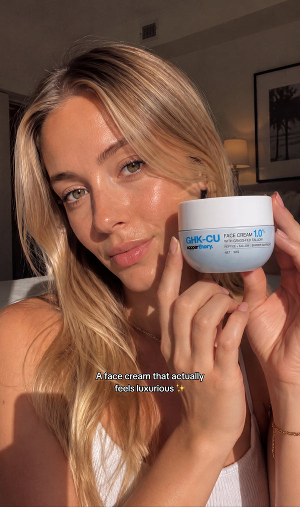 Customer holding CopperTheory GHK-Cu copper peptide face cream in a skincare routine video